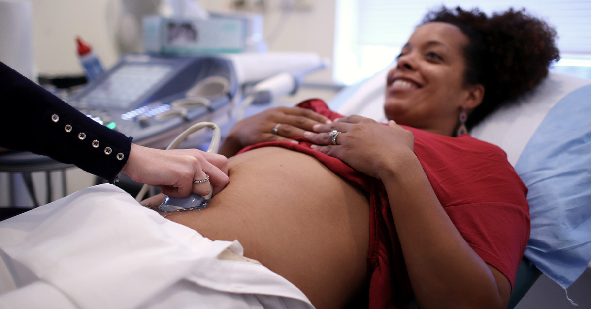 A female receiving an ultrasound for fibroids during pregnancy.